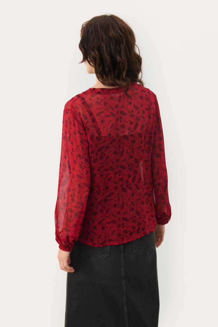 Blouse transparente avec motif de feuilles